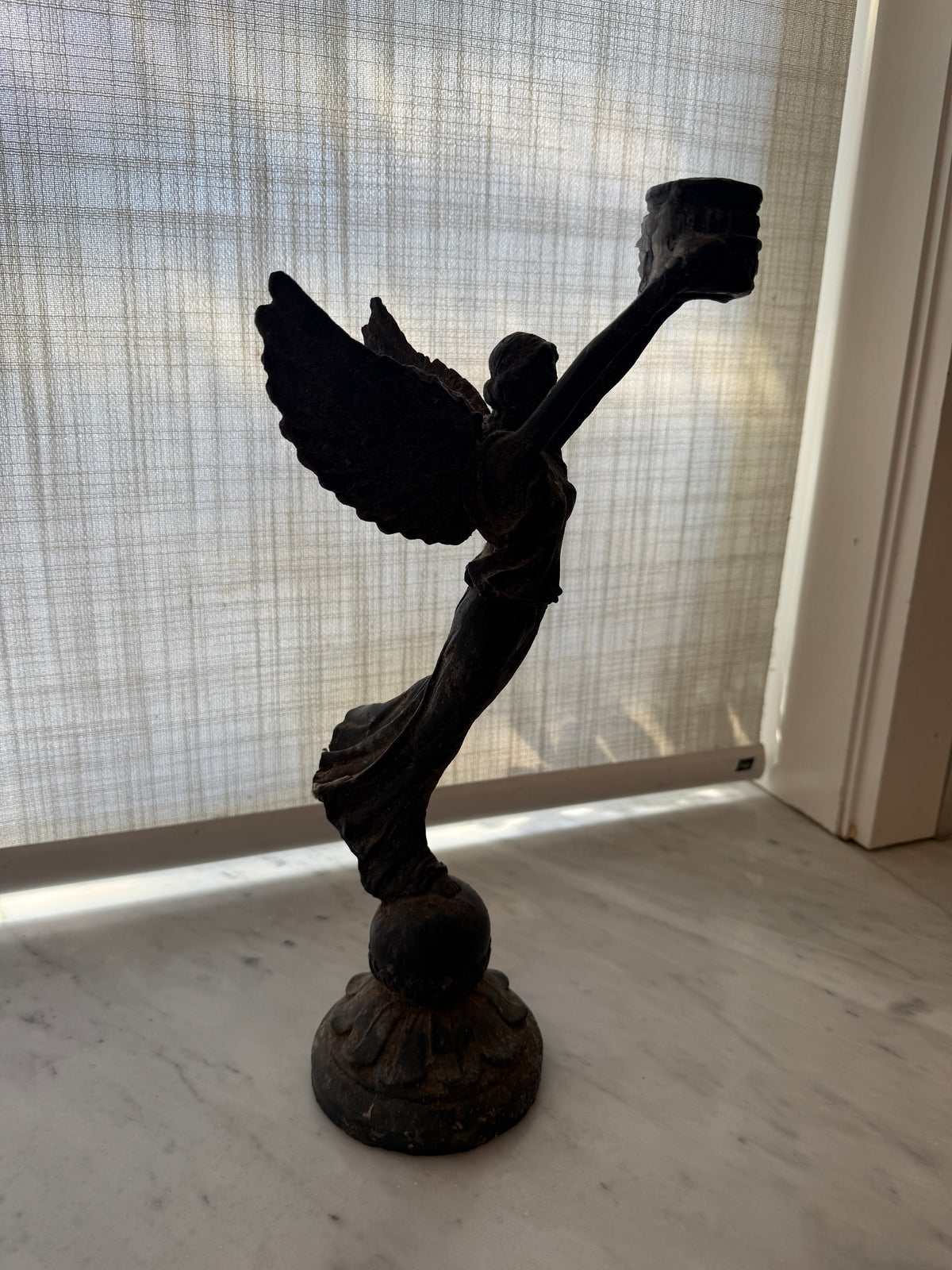 Cast iron angel candle - hire