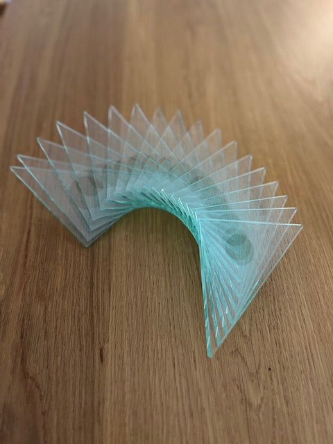 Glass triangular sculpture